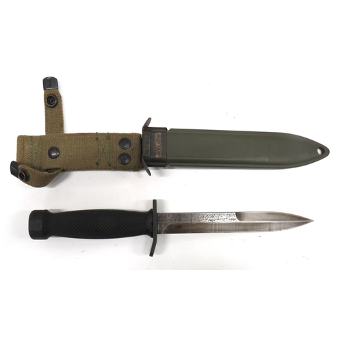 517 - Post War German Made Combat Knife
6 3/4 inch, part double edged blade.  Steel, turn up crossgua... 