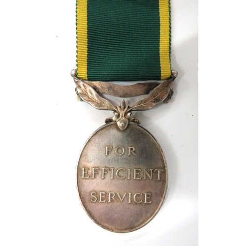 94 - Territorial Efficiency Medals And Various WW2 Medals
consisting King George VI example named 