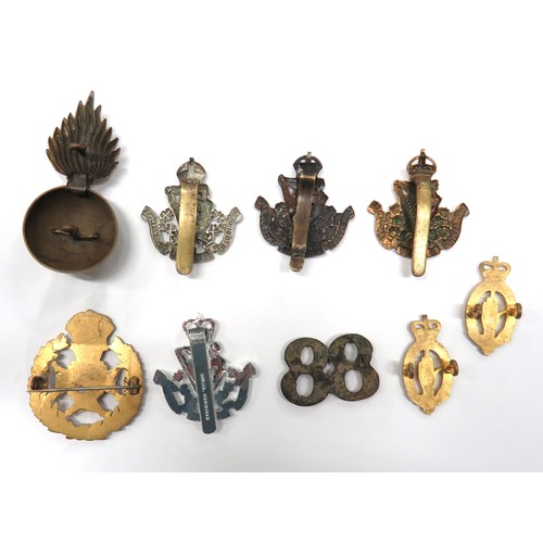 59 - 9 x Various Badges Including Irish Examples
consisting cast brass 88.  Rear with cast lugs ... Brass... 