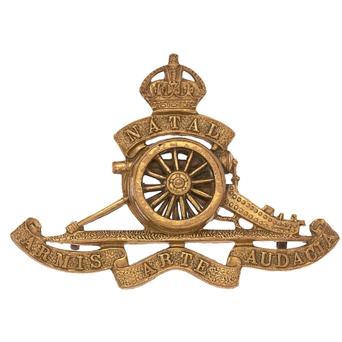 131 - South African Natal Field Artillery post 1902 cap badge.  Good scarce die-stamped brass cowned NATAL... 