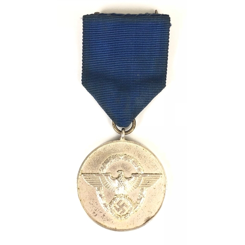 378 - German Third Reich Police 8 year Service Medal.  Good silvered example bearing wreath this eagle and... 