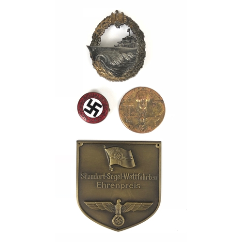 387 - German Third Reich insignia.  NSDAP membership badge in red and white enamels with black central swa... 