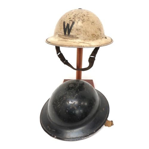 155 - Two WW2 Home Front MKII Steel Helmets
consisting a white painted example with black 'W