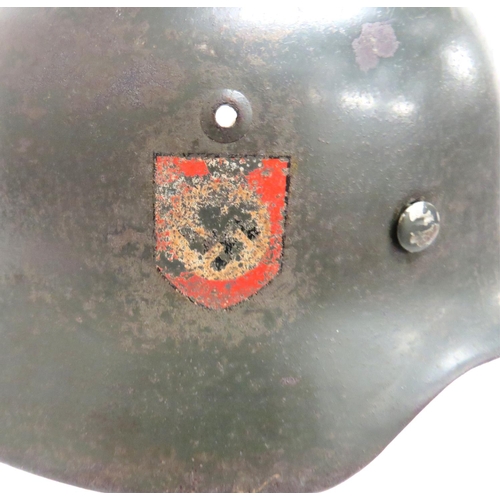 293 - WW2 Third Reich German Police M35 Steel Helmet
grey green painted crown with lower rolled rim.  ... 