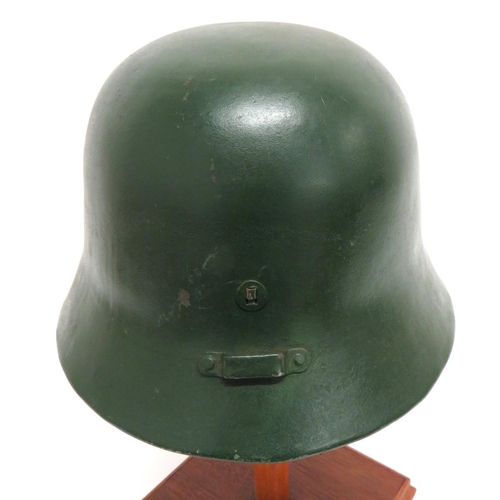 299 - Scarce Hungarian M1938 Steel Helmet
green painted crown.  Lower rolled edge brim.  The rea... 