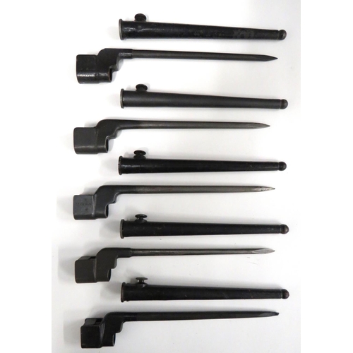 Five British No 4 MK2 Spike Bayonets
8 inch spike blades.  Blackened sockets, all with various stamps.  Complete in their blackened steel scabbards.  5 items.