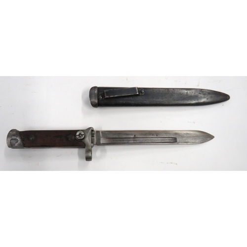Italian M1891/38 Folding Blade Bayonet
7 inch, single edged blade with fuller. &nbsp;Steel muzzle ring, crossguard and push operating button. &nbsp;Steel pommel. &nbsp;Wooden slab grips. &nbsp;Contained in its steel scabbard with belt loop. &nbsp;
