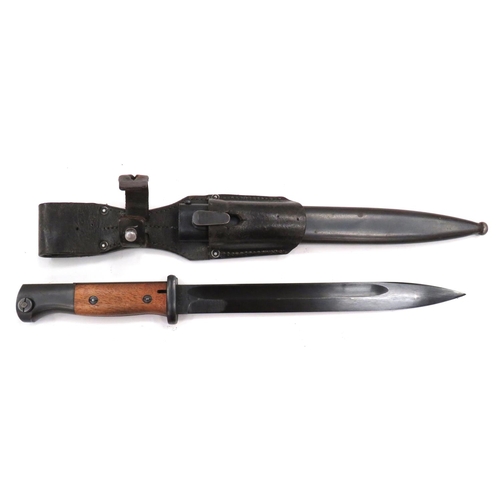 Third Reich German K98 Matching Numbers Bayonet
10 inch, blackened, single edged blade with fuller. &nbsp;Forte marked "43 AGV" and number "7016". &nbsp;Blackened steel crossguard and pommel. &nbsp;Wooden slab grips. &nbsp;Contained in its blackened steel scabbard marked "43 AGV" and number "7016". &nbsp;Complete with its leather frog and retaining strap. &nbsp;