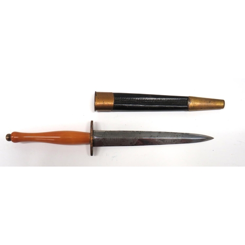 Rare Tom Beasley Sword Smith Fairbairn & Sykes Commando Knife
6 3/4 inch, double edged blade. &nbsp;Etched triple scrolls "Hand Forged By Tom Beasley The Famous Sword Smith Of Stalingrad Fame". &nbsp;The reverse with scroll edged panels "Commando Fighting Knife World War 1939-1945". &nbsp;Similar lower panel with Wilkinson Sword London logo and crest. &nbsp;Forte marked "Made In England". &nbsp;Gilt finished, oval crossguard. &nbsp;Yellow composite, smooth grip. &nbsp;Gilt finished pommel nut. &nbsp;Contained in its leather scabbard with gilt finished throat and chape. &nbsp;
