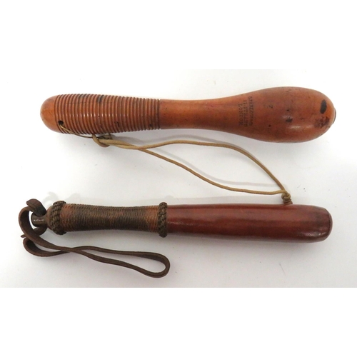 Two 19th Century Ship's Persuaders/Priests
consisting 10 inch, turned wooden example. &nbsp;The grip with multi grooves. &nbsp;Body with maker "C Farlow & Co 91 Strand London". &nbsp;Lower brass loop with cord wrist strap ... Similar, 9 1/2 inch, leather covered, weighted example. &nbsp;Woven cord bound grip. &nbsp;Leather wrist strap. &nbsp;2 items.
