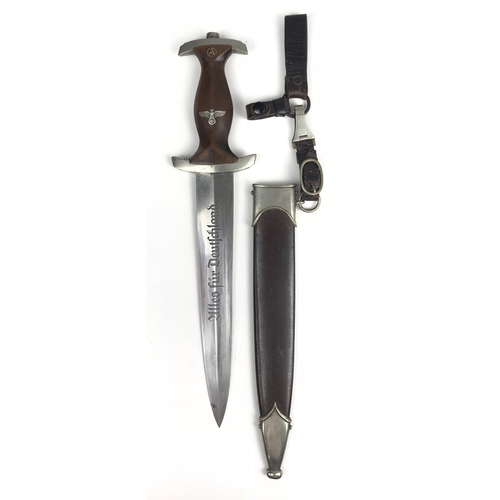 German Third Reich SA Group Pommern Stormtrooper dagger by Karl Boker, Solingen.  Scarce example with nickel mounts, the blade etched 'Alles fur Deutschland', the reverse bearing maker's oval logo. Brown wooden grip inlaid with silvered eagle and swastika and enamelled circular SA device; crossguard stamped with P (SA Group Pommern). Housed in brown anodised scabbard with nickel mounts, the top mount with single suspension ring. Complete with suspension strap with spring clip,  upright small leather grip strap and belt loop. Minor service wear, generally VGc.        SA (Sturmabteilung) Brown Shirts dagger introduced in 1933.PAYMENT BY BANK TRANSFER ONLY