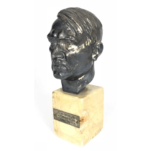 German Third Reich bust of Adolf Hitler Luftwaffe Interest.  Presented in November 1938 at the Luftwaffe camp at Rechlin airfield. Depicts the head of Hitler raised on a marble plinth, this retaining presentation plaque. Total height including plinth approximately 21 cm. The head was originally silver-plated which has worn to the base metal, chip to marble plinth.        The Rechlin airfield was a prewar station and was used for aircraft testing, during WW2 it was home to the famous special operations combat wing of the Luftwaffe, KG 200, with its array of captured Allied aircraft PAYMENT BY BANK TRANSFER ONLY