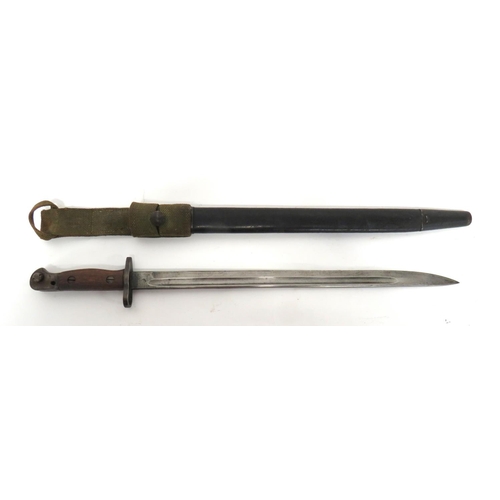 British WW1 P1907 SMLE Bayonet
17 1/4 inch, single edged blade with fuller. &nbsp;Forte with maker "Wilkinson" dated "9/17". &nbsp;Steel muzzle ring, crossguard and pommel. &nbsp;Wooden slab grips. &nbsp;Contained in its leather scabbard with steel mounts. &nbsp;Complete with 1937 pattern, webbing frog. &nbsp;