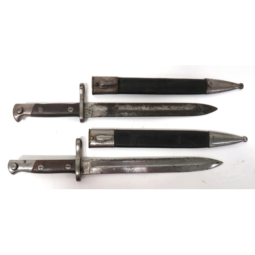 Two Spanish M1893 Mauser Contract Bayonets
10 inch, single edged blades with wide fullers. &nbsp;Forte stamped "P.R.8". &nbsp;Steel muzzle ring, crossguard and pommel. &nbsp;Wooden slab grips. &nbsp;Contained in their steel mounted, leather scabbards. &nbsp;2 items.