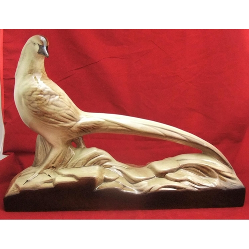 106 - French porcelain bird with long-tail, unidentified marks to base, 49cm in length by 13cm width.