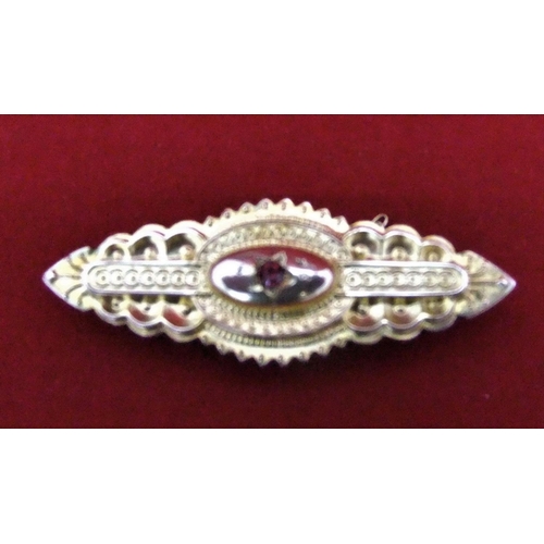 19 - 9ct gold brooch with small central ruby, 3.2gm,

P & P – UK £10+VAT, EU £15+VAT, RoW £25+VAT.