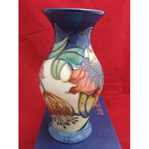 94 - boxed Moorcroft vase of baluster shape in Anna Lilly pattern, 20cm height, marks to base.