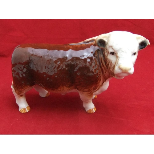 99 - Large vintage unmarked ceramic butchers shop bull in dark brown.approx 26 cms in length.