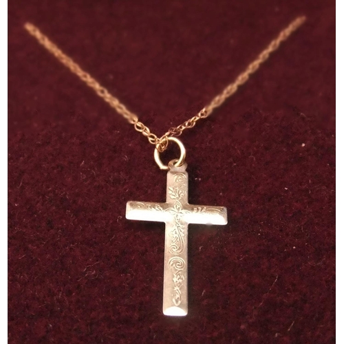 10 - 9ct rose gold cross on 9ct gold chain with engraved decoration to cross