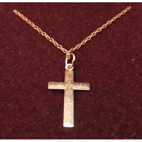 10 - 9ct rose gold cross on 9ct gold chain with engraved decoration to cross