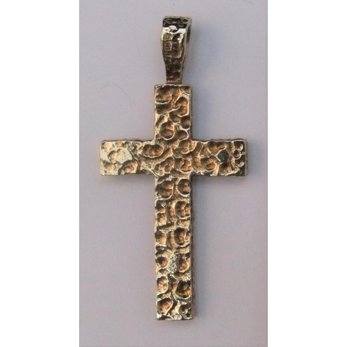 19 - 9ct yellow gold pendant, double sided cross.

One side depicts Jesus on the cross the other modernis... 