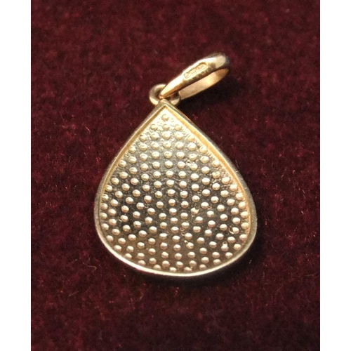 20 - 9ct gold hammered oval pendant 

1.1 gram