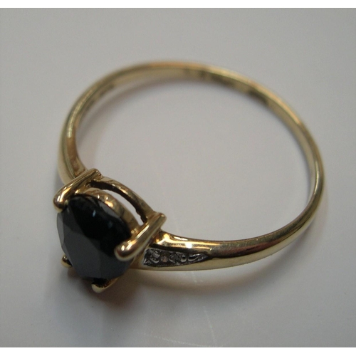 25 - 9ct gold ring with a tear drop sapphire with diamonds

1.6 grams gross,    size P/Q