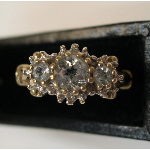 36 - 9ct gold and diamond cluster ring, the main 3 diamonds set raised in a central line with the central... 