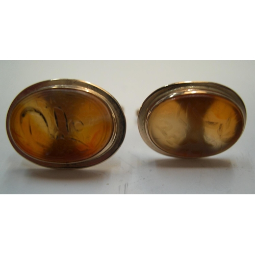 39 - Pair of imported yellow gold (stamped 14 carat) & agate cufflinks, with Arabic/Eygptian script 

8.4... 