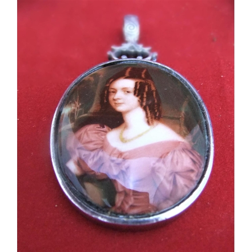 49 - Vintage porcelain pendent of young lady in silver mount, 28 grams, 6cms including the hanging clasp