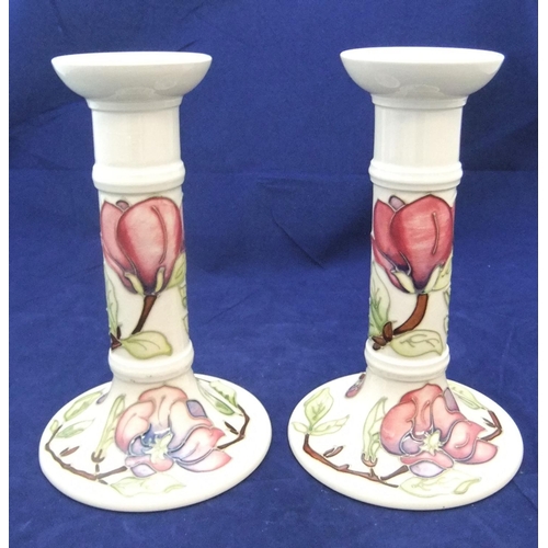 103 - Pair of Moorcroft candlesticks,

both 22cm high