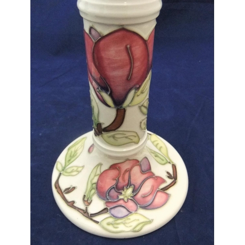 103 - Pair of Moorcroft candlesticks,

both 22cm high