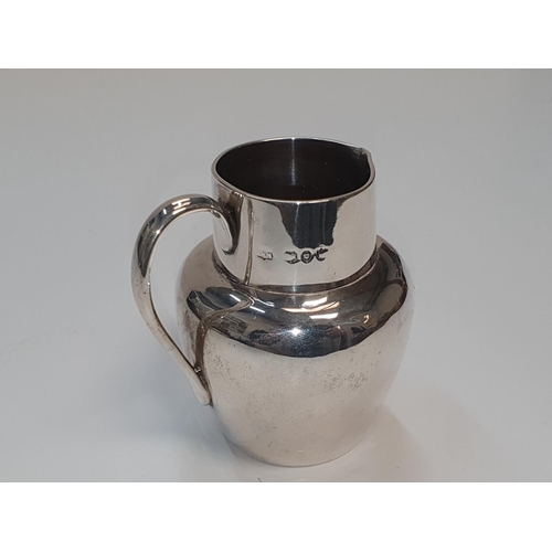 136 - Hallmarked, small silver cream jug in plain form, 

93 grams