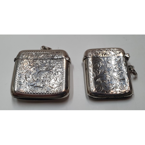 124 - 2 - Early 20thC hallmarked silver vesta cases, both heavily engraved,

Total combined weight approx ... 