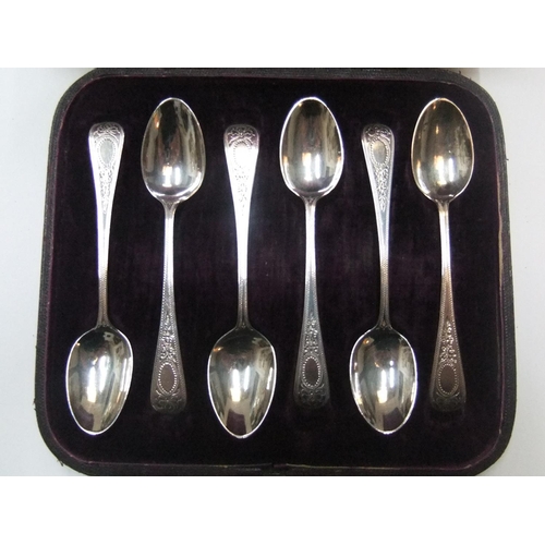 103 - Antique set of British silver tea spoons with extensive matching engraved handles