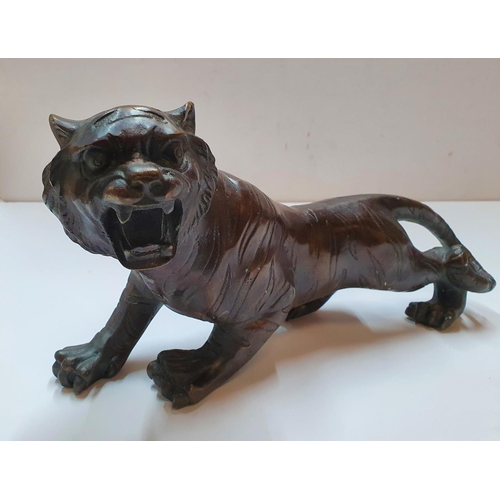 179 - Antique unmarked Chinese bronze tiger,

30 cm in length