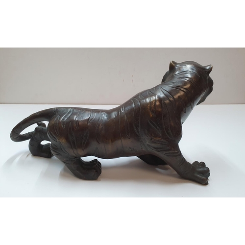 179 - Antique unmarked Chinese bronze tiger,

30 cm in length