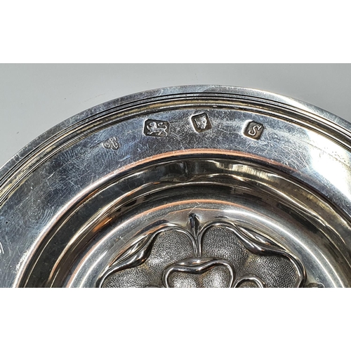 108 - Hallmarked 20thC circular silver dish embossed with the English rose and extensively engraved to und... 