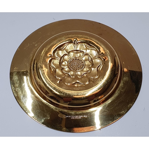 109 - Hallmarked silver gilt, 1963 circular dish embossed with an English rose by Hickleton & Phillips