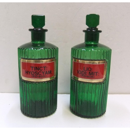 186 - Pair of antique green glass, labelled, poison chemists bottles

Each bottle measures approx 21 cm hi... 