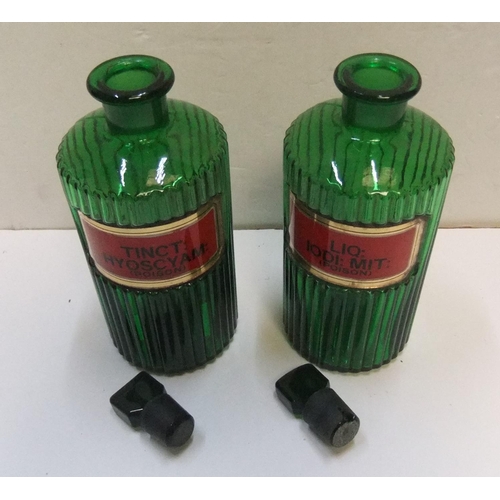 186 - Pair of antique green glass, labelled, poison chemists bottles

Each bottle measures approx 21 cm hi... 