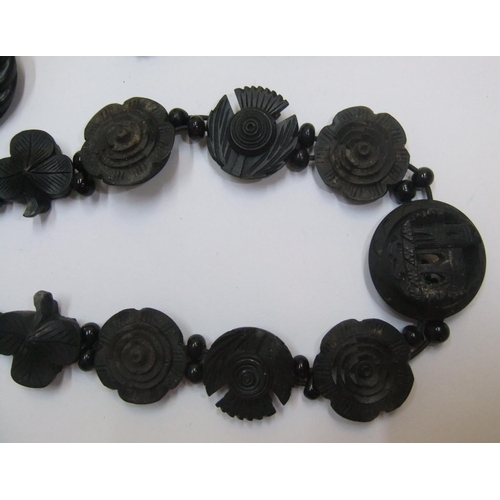 67 - Victorian Whitby jet ladies jewellery mourning set to include an ornately carved choker, earrings & ... 