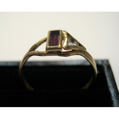 16 - Unmarked yellow metal ring with clear stone and garnet

Approx 1.4 grams gross           size R