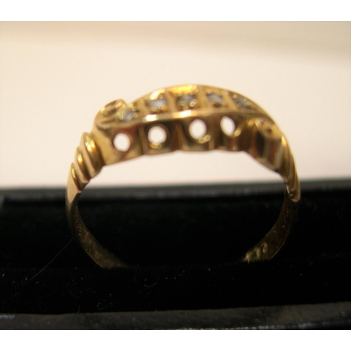 17 - 18ct yellow gold, boat shaped ring with 5 square cut diamonds

Approx 1.9 grams gross,              ... 