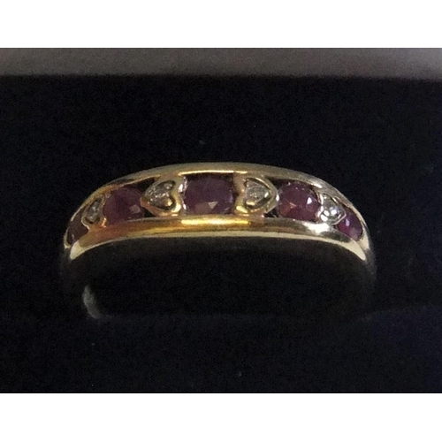 3 - 9ct yellow gold ring with round cut rubies interspersed with diamonds 

approx 2.3 grams gross,     ... 