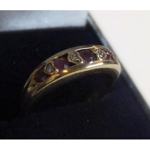 3 - 9ct yellow gold ring with round cut rubies interspersed with diamonds 

approx 2.3 grams gross,     ... 