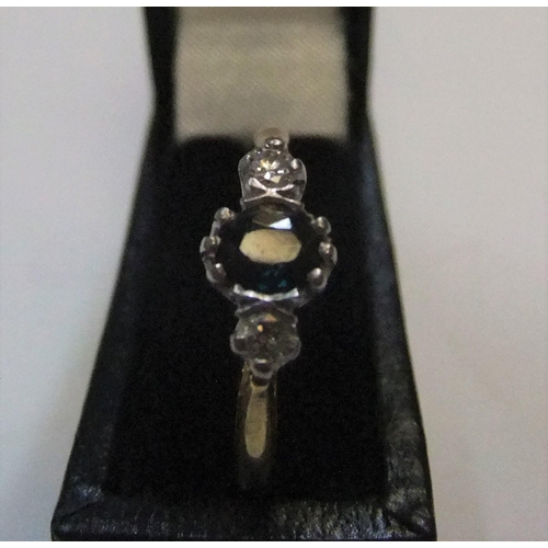 5 - 18ct yellow gold ring set with a central sapphire with a diamond on either side

Approx 4.5 grams gr... 