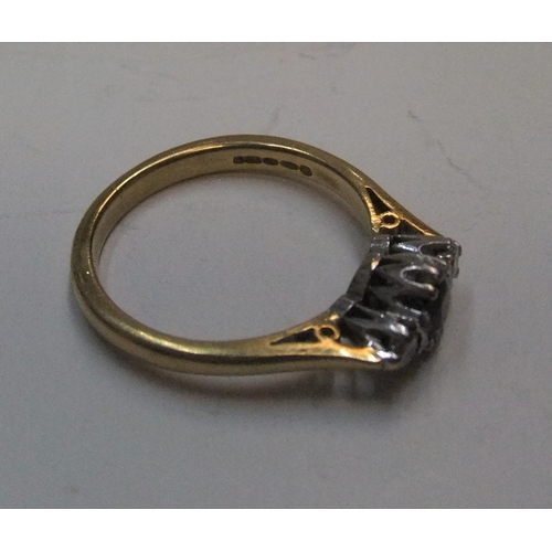 5 - 18ct yellow gold ring set with a central sapphire with a diamond on either side

Approx 4.5 grams gr... 