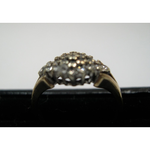 6 - 9ct yellow gold, diamond cluster ring

Approx 2.7 grams gross,          size K