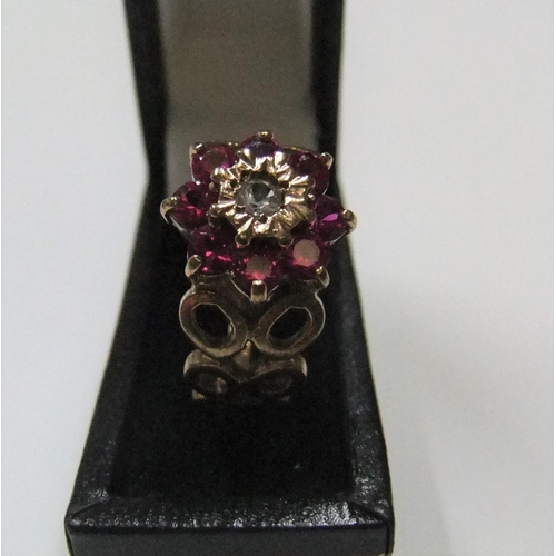 56 - Modernist 9ct yellow gold ruby cluster ring with unusual circular shoulders

Approx 3.2 grams gross,... 